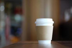 Paper coffee cup in coffee shop. photo