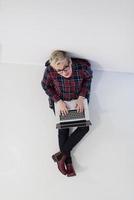 top view of young business woman working on laptop computer photo