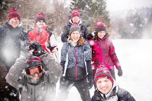 portrait of group young people in beautiful winter landscape photo