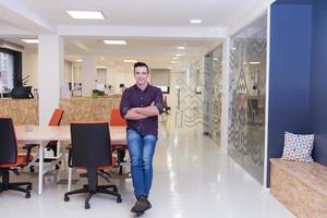 young startup business man portrait at modern office photo