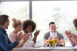 multiethnic startup Group of young business people celebrating success photo