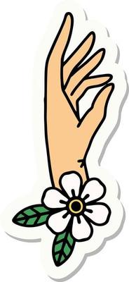 sticker of tattoo in traditional style of a hand and flower