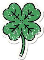 distressed sticker tattoo in traditional style of a 4 leaf clover vector