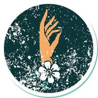icónica imagen de estilo de tatuaje de pegatina angustiada de una mano y una flor vector