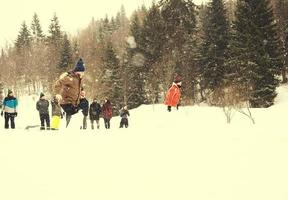 group of young people having a running in bag competition photo