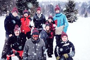 portrait of group young people in beautiful winter landscape photo