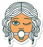 pegatina de tatuaje al estilo tradicional de una cara femenina guiñando el ojo con una mordaza de bola vector