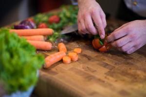 closeup of Chef hands preparing beef steak photo