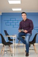 young startup business man portrait at modern office photo