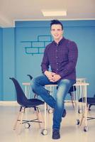 young startup business man portrait at modern office photo