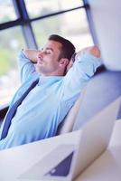 happy young business man at office photo