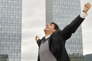 Photo of happy winner businessman  screaming from joy