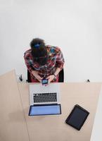 top view of young business woman working on laptop photo