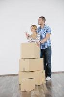 Young couple moving in new house photo