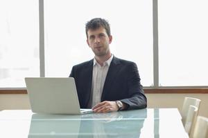 young business man alone in conference room photo