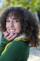 Young curly woman smiling photo
