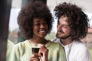 happy multiethnic couple relaxing at modern home indoors photo