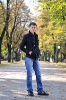 happy young casual man outdoor portrait posing photo