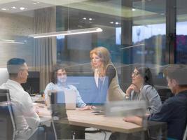 Startup Business Team At A Meeting at modern night office building photo