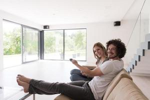 young couple relaxes in the living room photo