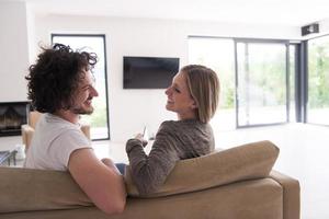 Rear view of couple watching television photo