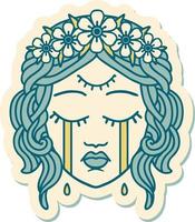 sticker of tattoo in traditional style of female face with third eye and crown of flowers cyring vector