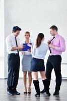 Group of young business people at meeting photo