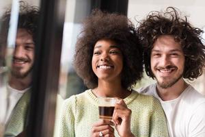 happy multiethnic couple relaxing at modern home indoors photo