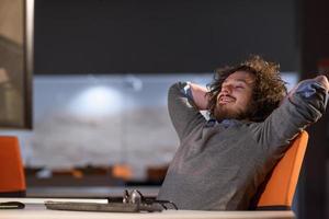 businessman relaxing at the desk photo