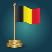 Belgium national flag on golden pole on gradation isolated dark background. table flag, vector illustration