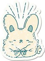 worn old sticker of a tattoo style happy rabbit vector