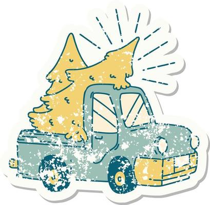 worn old sticker of a tattoo style truck carrying trees