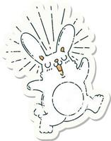 worn old sticker of a tattoo style prancing rabbit vector