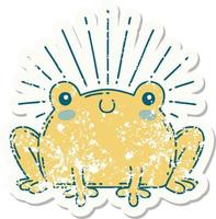 worn old sticker of a tattoo style happy frog vector