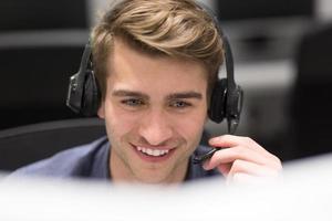 male call centre operator doing his job photo