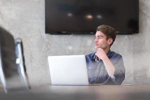 businessman working using a laptop in startup office photo