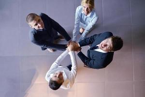 business people group joining hands photo