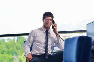 happy young business man at office photo