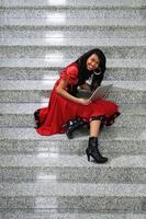 business woman with laptop on staircase photo