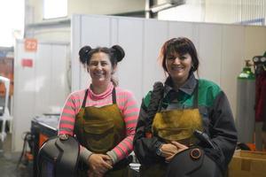 portrait of two welders holding welding masks in their hands and preparing for hard work in a factory photo