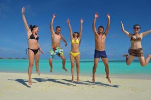 group of happy young people have fun on bach photo