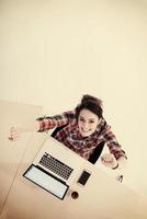 top view of young business woman working on laptop photo