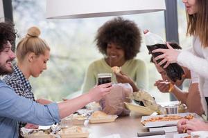 multiethnic group of happy friends lunch time photo