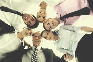 business people with their heads together photo