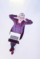 top view of young business woman working on laptop computer photo