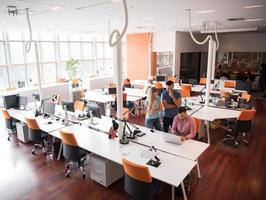 Group of young people employee workers with computer photo