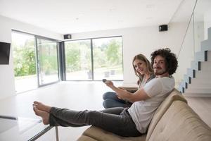 young couple relaxes in the living room photo