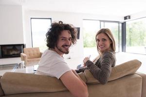 Rear view of couple watching television photo