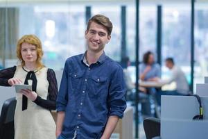 Business People Working With Tablet in startup office photo