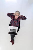 top view of young business woman working on laptop computer photo